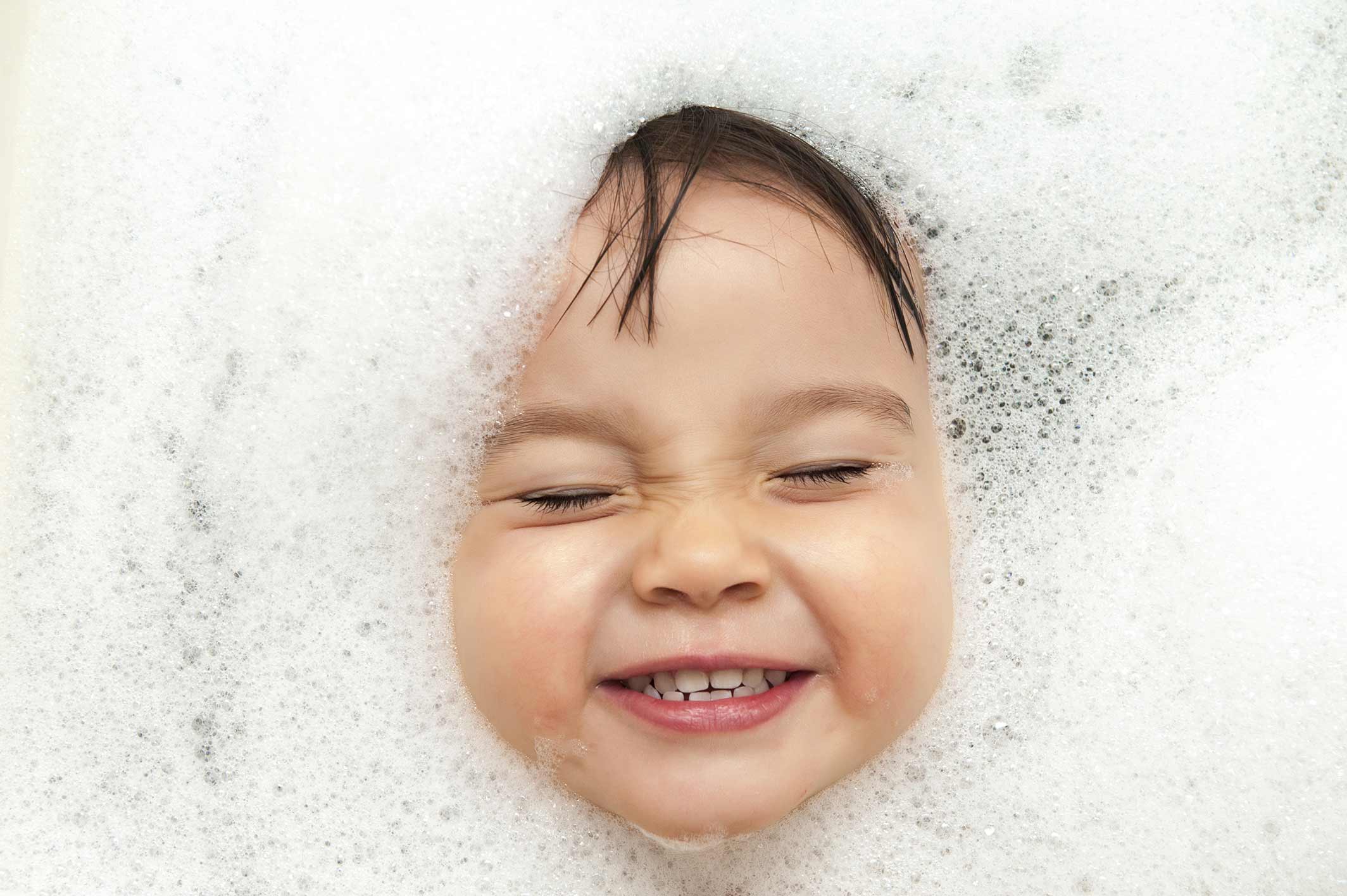 Child face covered with foam